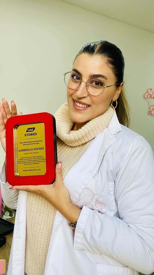 Gabriella Younes receiving a maternity care award