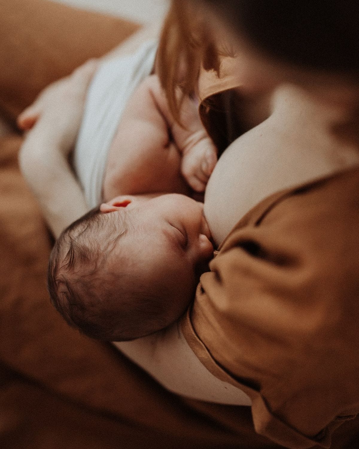 A lactation consultant listening to a new mother